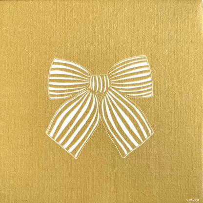 Eclectic Françoise Paviot gold airlaid dinner napkin featuring a white linear ribbon bow design for festive tables.