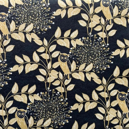 Eclectic Françoise Paviot Hibou Nuit dinner napkins featuring a midnight blue background with golden owl and leaf motifs.