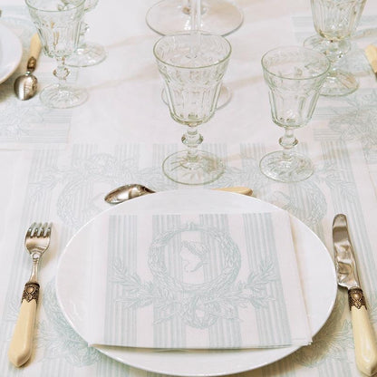 Eclectic Françoise Paviot Madame Vert airlaid dinner napkin with green wreath motif on a formal table setting