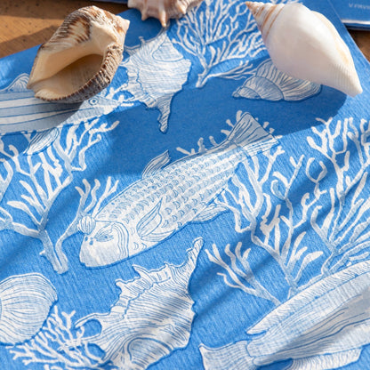 Eclectic Françoise Paviot Fonds Marin blue airlaid dinner napkin with white fish and coral marine motifs