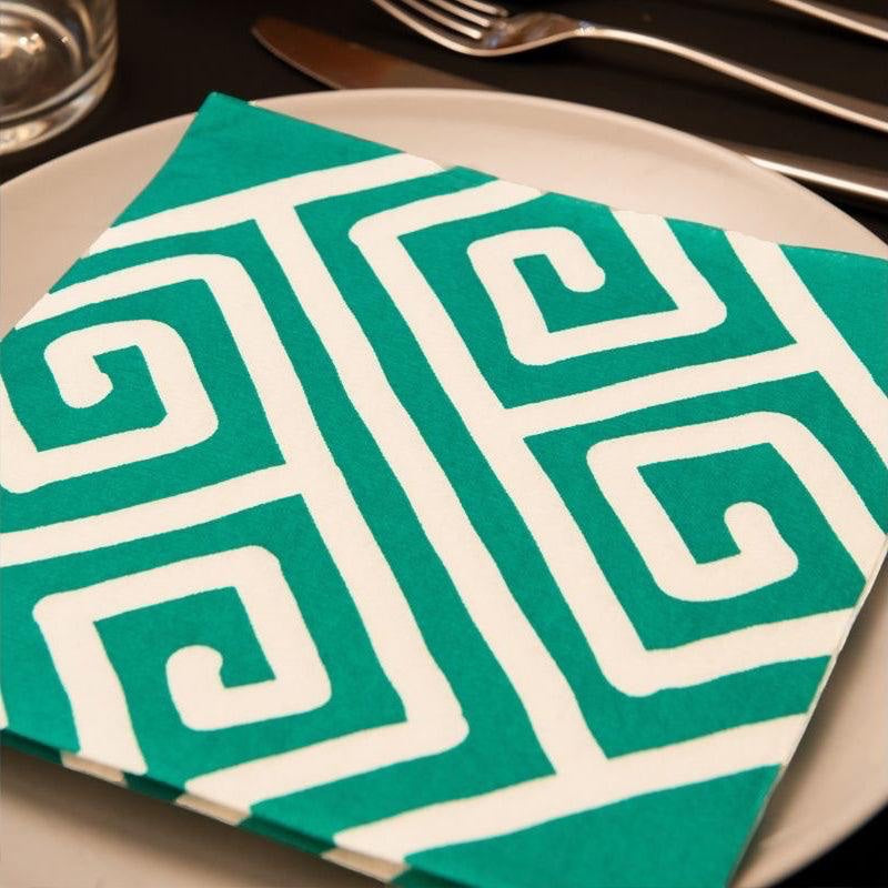 Eclectic Françoise Paviot Milos Vert green and white geometric airlaid dinner napkin on a plate