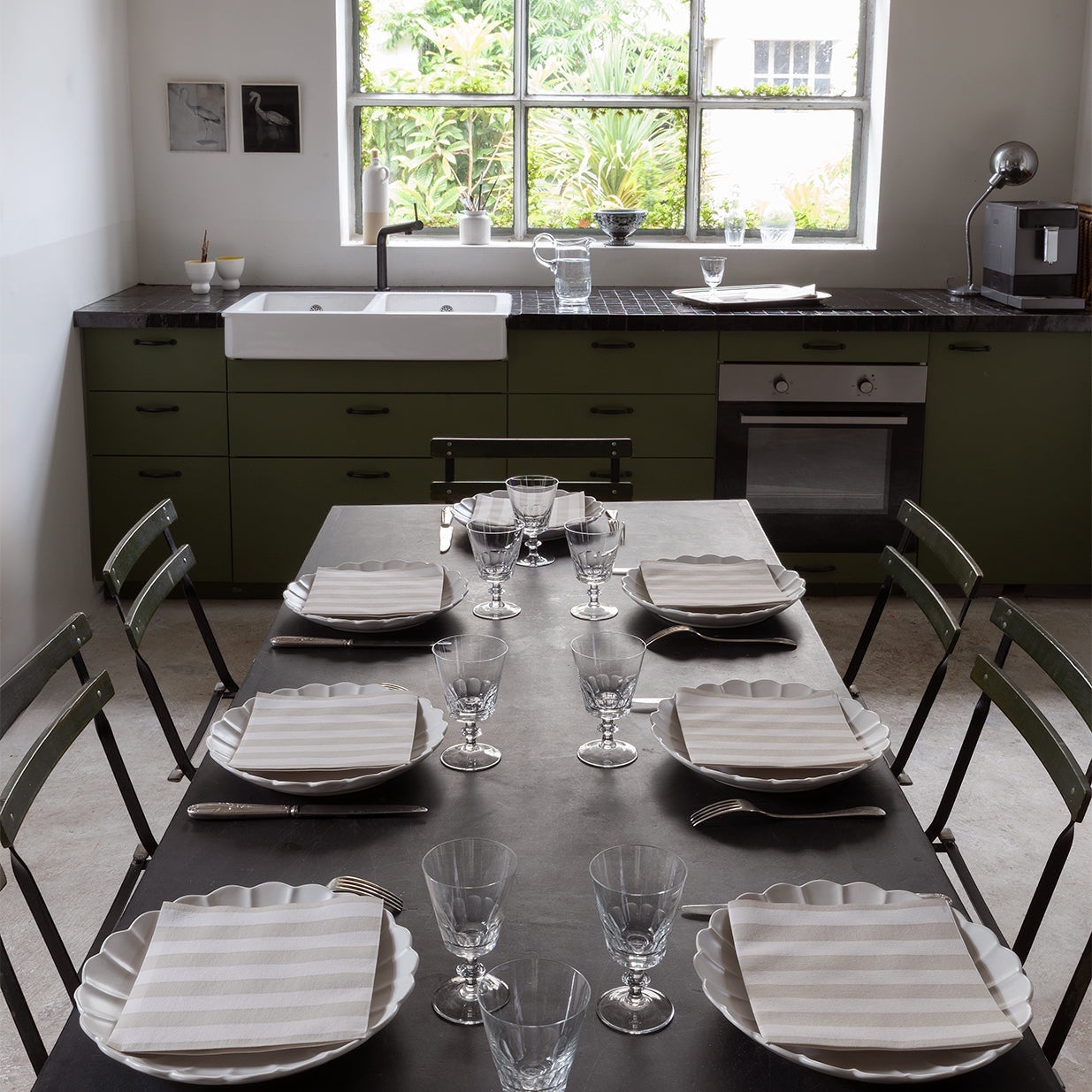 Eclectic Françoise Paviot Rayure Mocha striped airlaid dinner napkins set on a modern dining table in a kitchen