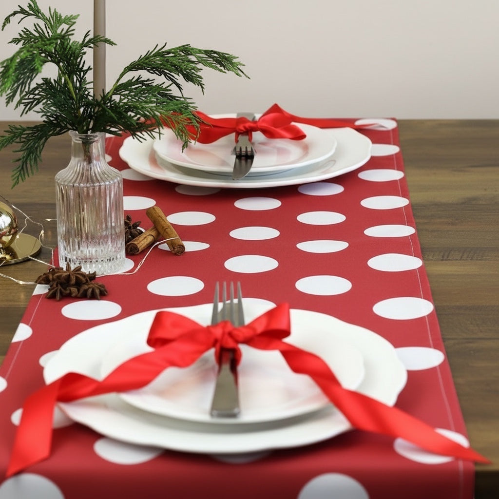 Eclectic Françoise Paviot red and white polka dot airlaid table runner set on a wooden table with festive decor