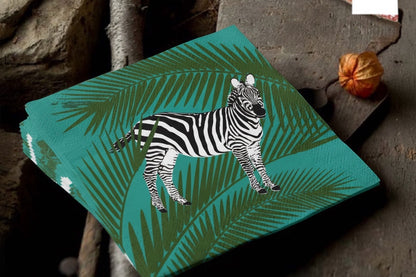 Eclectic Françoise Paviot zebra print cocktail napkin with green palm leaves on premium airlaid linen-like material.