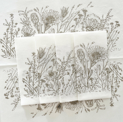 Eclectic Fynbos oatmeal botanical print airlaid napkins with a linen-like texture on a white background.