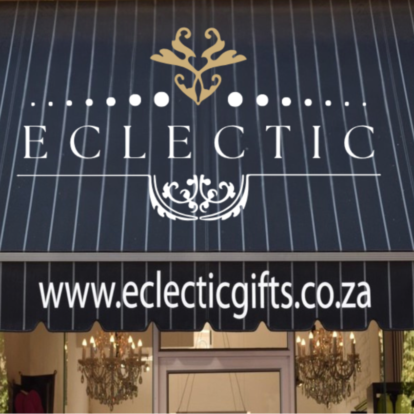 Eclectic Gifts storefront sign with the website displayed above the entrance.
