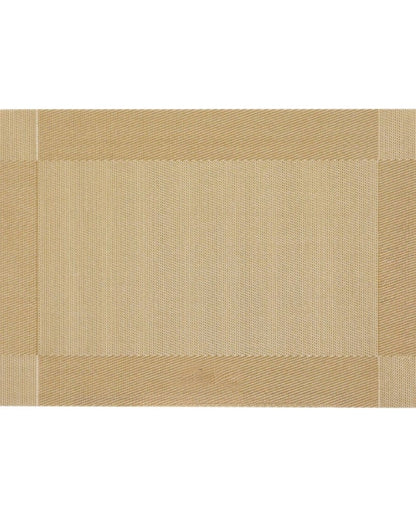 Eclectic rectangular gold woven PVC placemat with a textured border for a sophisticated dining table setting.