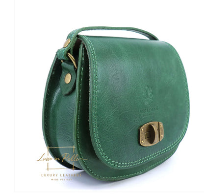 Eclectic green Italian leather crossbody bag with a structured silhouette, brushed brass hardware, and twist-lock.
