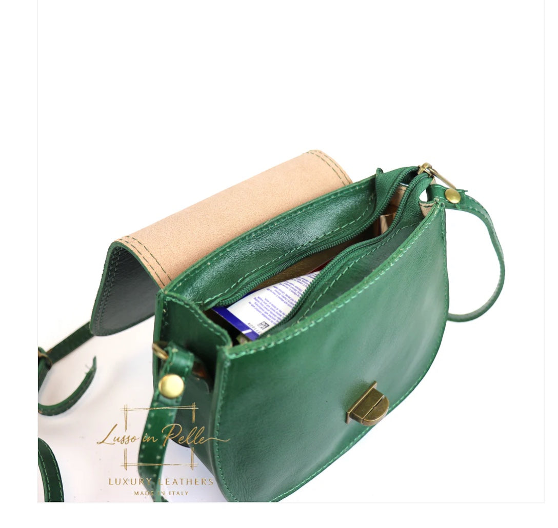 Eclectic green Italian leather crossbody bag with brushed brass hardware, open top, and natural leather lining.