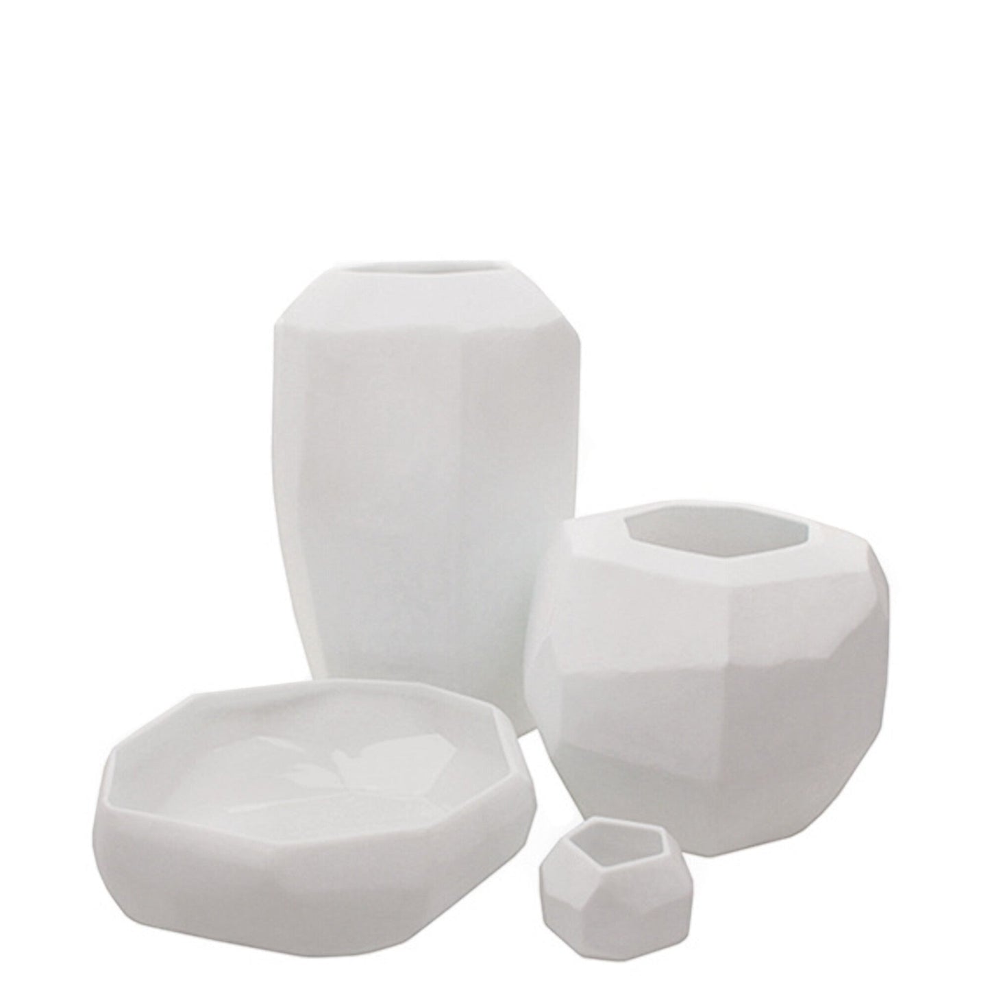 Eclectic Guaxs Cubistic opal white glass vases in various sizes with faceted geometric surfaces and matte finish.