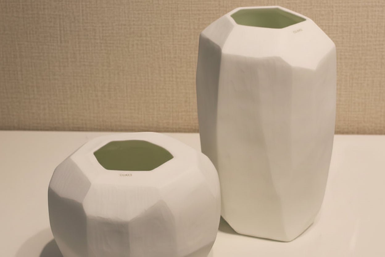 Eclectic Guaxs Cubistic opal white glass vases with faceted hand-cut surfaces in tall and short sizes