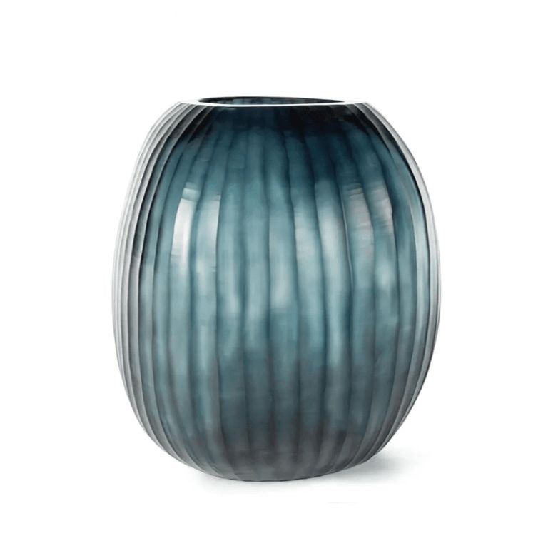 Eclectic Guaxs Patara round mouth-blown glass vase in ocean blue with a hand-cut pleated texture.