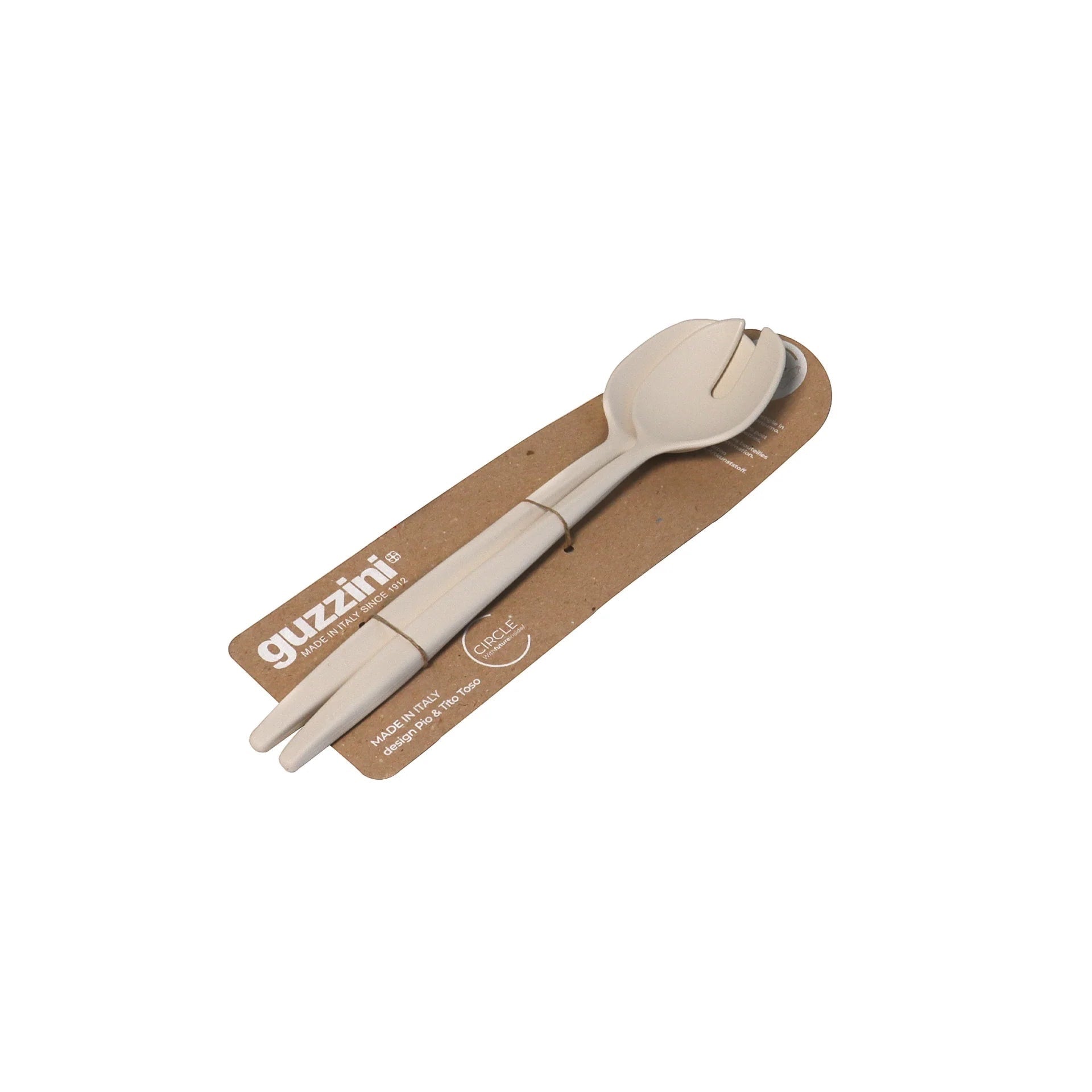 Eclectic Guzzini Tierra milk white recycled plastic salad server set on cardboard packaging