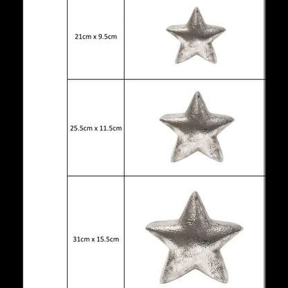 Eclectic hammered silver ceramic star sculptures in three different sizes for decorative home styling.