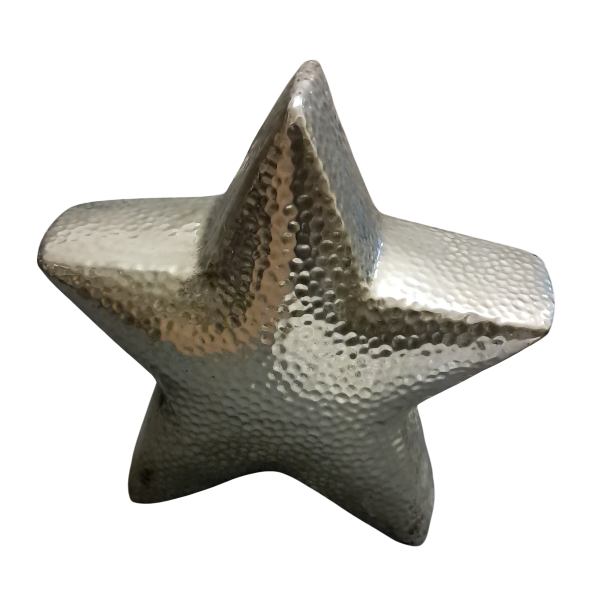 Eclectic hammered silver ceramic star sculpture with a textured faceted surface for modern home decor.
