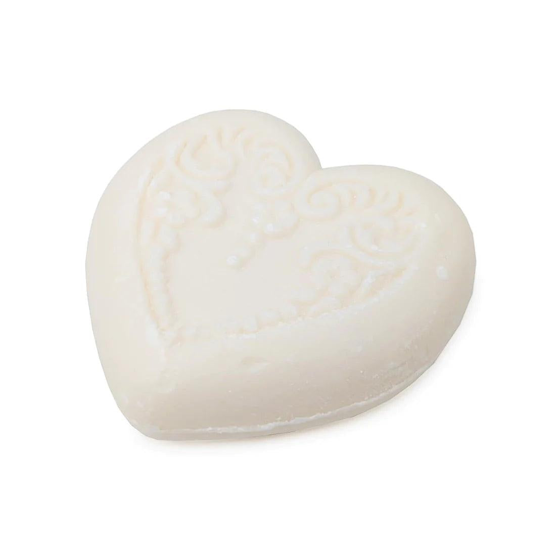 Eclectic heart-shaped ivory vegetable-based soap with embossed floral detailing and a fresh bergamot and lemon scent.