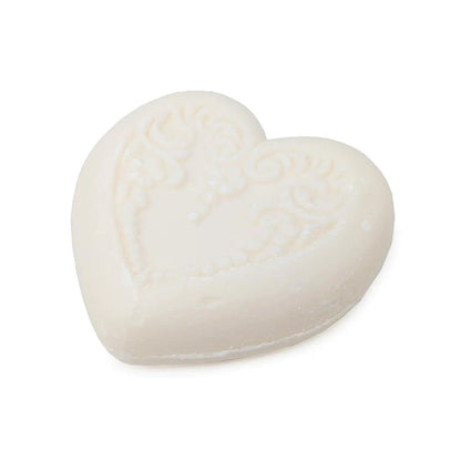 Eclectic heart-shaped ivory vegetable-based soap with embossed floral detailing and a fresh bergamot and lemon scent.