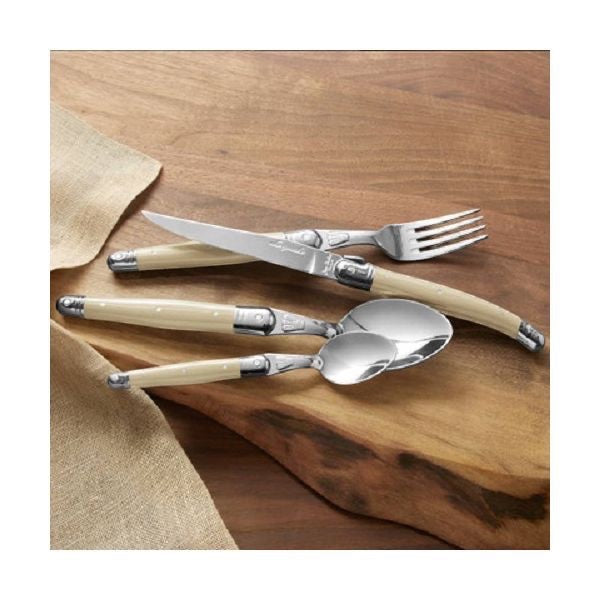 Eclectic Jean Dubost Laguiole Victoria cutlery set with cream ABS handles and stainless steel on a wooden board