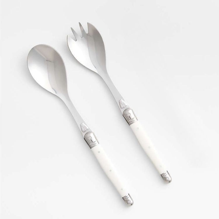 Eclectic Jean Dubost Laguiole salad server set with stainless steel heads and ivory-coloured ABS handles featuring bee emblem
