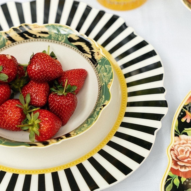 Eclectic Jenna Clifford Botanica Rose fine china server plate with black and white striped rim holding fresh strawberries