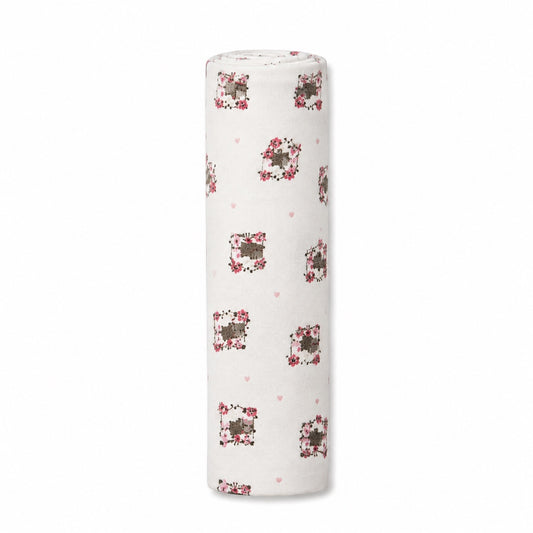 Eclectic Kitty print white cotton flannel baby blanket rolled up for nursery use