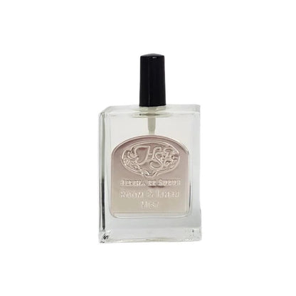Eclectic La Provence bergamot and lemon room and linen mist in a clear square glass bottle with a pewter emblem.