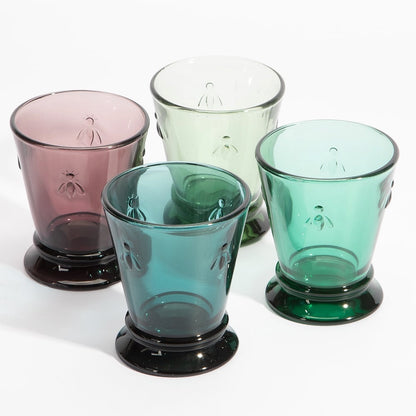 Eclectic La Rochère Abeille French Bee tumblers in four jewel tones with raised bee motifs on pressed glass