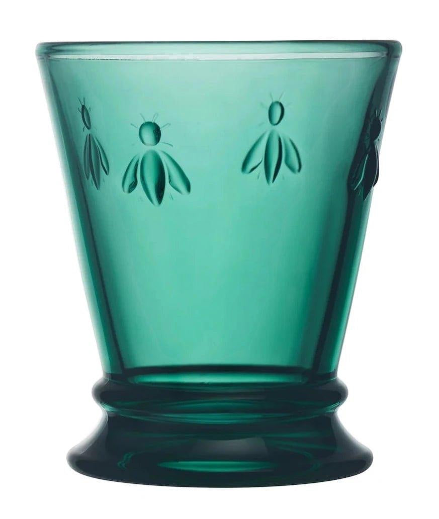 Eclectic La Rochère Abeille green pressed glass tumbler featuring an iconic Napoleonic bee motif and tapered design.