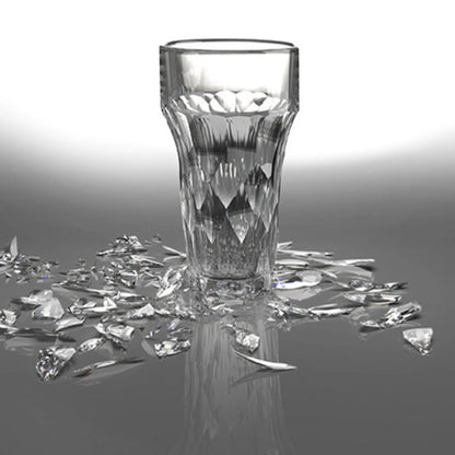 Eclectic La Rochère Silex clear pressed glass beer glass with faceted industrial design on a reflective surface.
