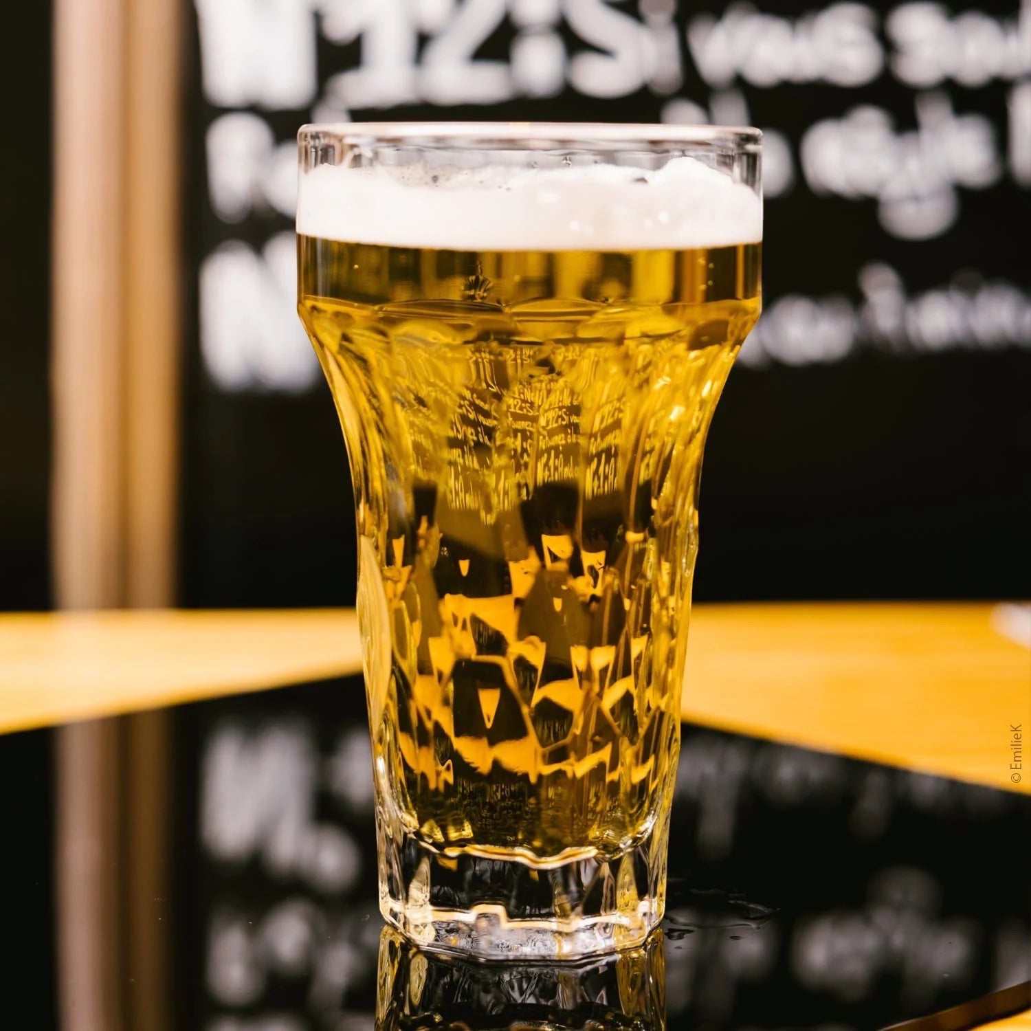 Eclectic La Rochère Silex clear pressed glass beer glass with a structured industrial design filled with lager