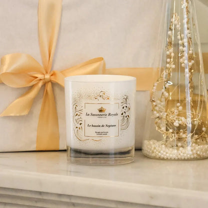 Eclectic La Savonnerie Royale Le Bassin de Neptune scented candle in an elegant white glass vessel with gold detailing.