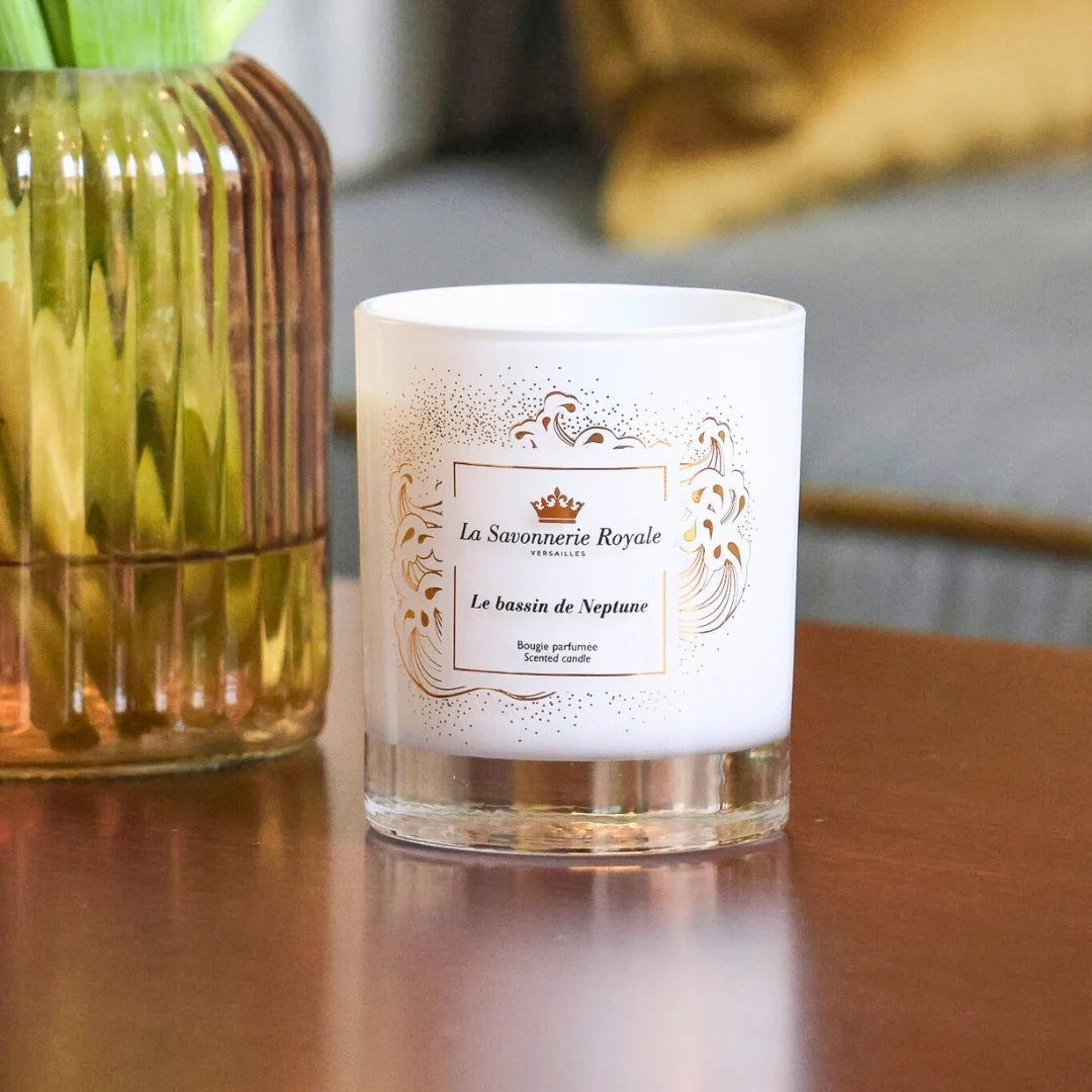 Eclectic La Savonnerie Royale Le Bassin de Neptune scented candle in a white glass vessel with gold ornate detailing.