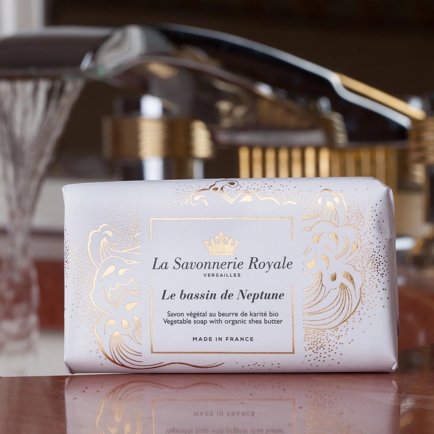 Eclectic La Savonnerie Royale Le Bassin de Neptune soap bar in elegant white packaging with gold fleur-de-lys details.