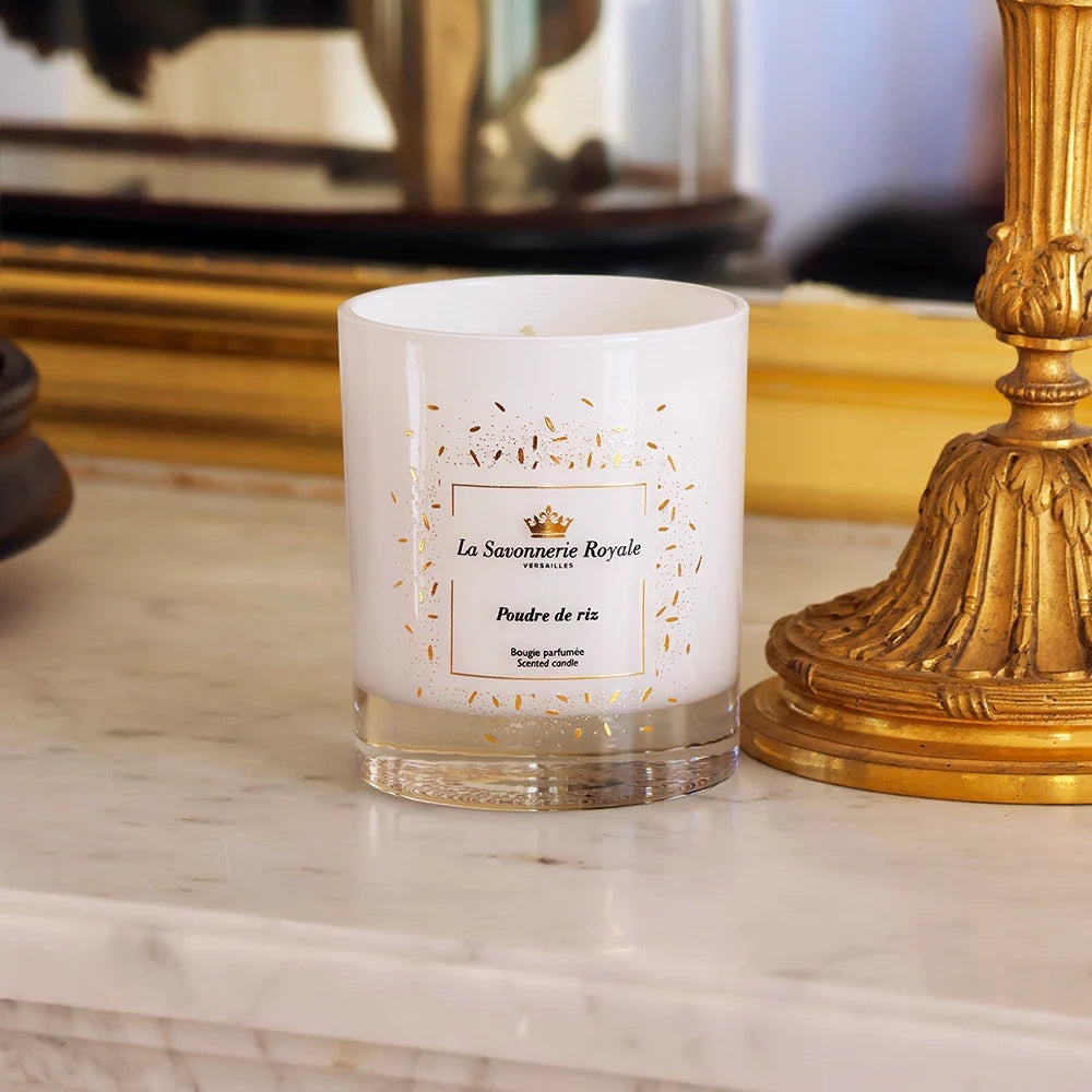 Eclectic La Savonnerie Royale Poudre de Riz scented candle in a white glass vessel with gold accents on marble