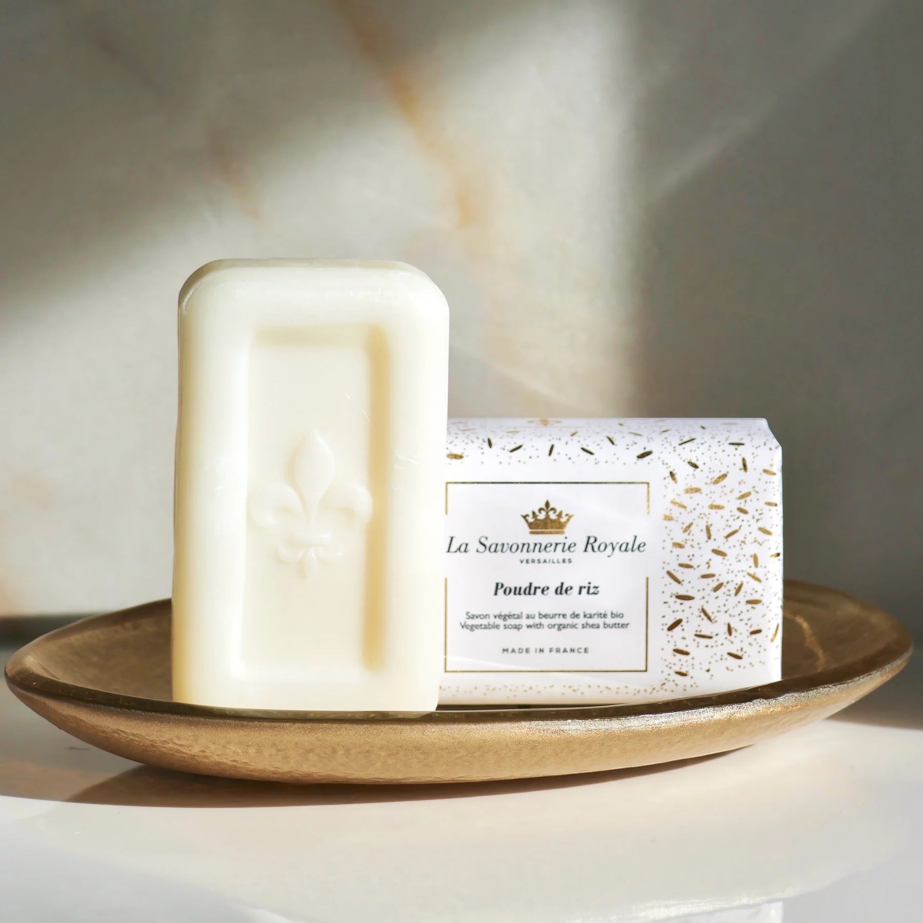 Eclectic La Savonnerie Royale Poudre de Riz soap bar with fleur-de-lys embossing and elegant illustrated packaging.