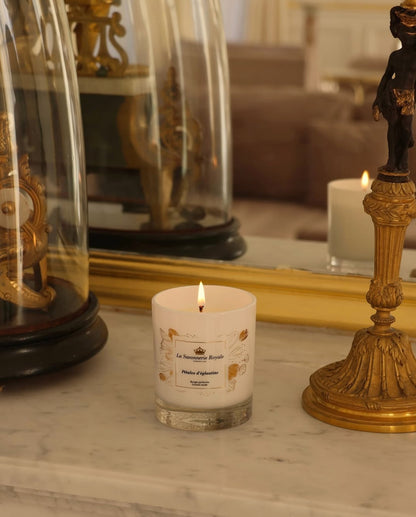 Eclectic La Savonnerie Royale Petales d'Eglantine rose scented candle in an ornate glass jar on a marble surface
