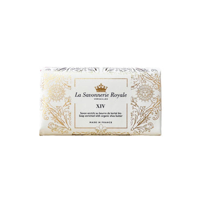 Eclectic La Savonnerie Royale XIV soap bar in ornate white and gold packaging with Sun King and Fleur-de-lys motifs.