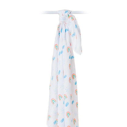 Eclectic Lulujo rainbow sky print cotton muslin swaddle blanket hanging against a white background