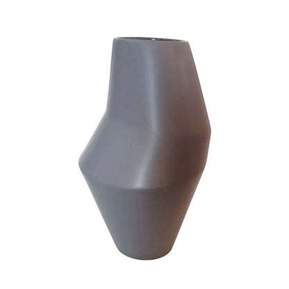 Eclectic tall matte grey ceramic vase with a faceted geometric silhouette and a smooth contemporary finish.