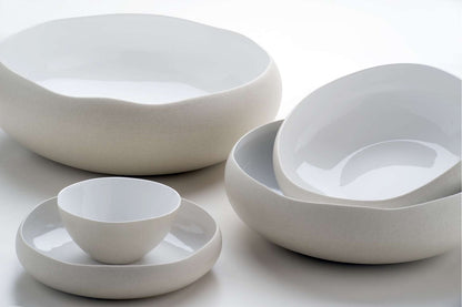 Eclectic Médard de Noblat Oslo stoneware bowls with matte linen exteriors and glossy white interiors.