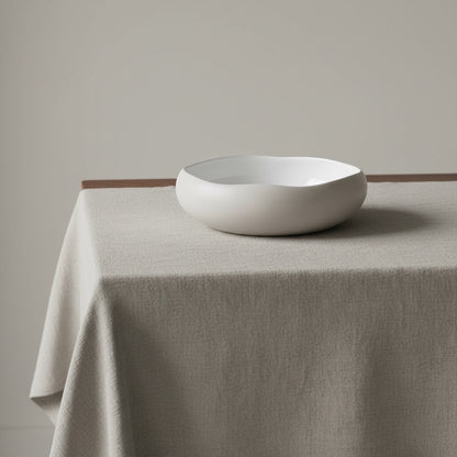 Eclectic Médard de Noblat Oslo stoneware serving bowl with matte linen exterior and glossy white interior.