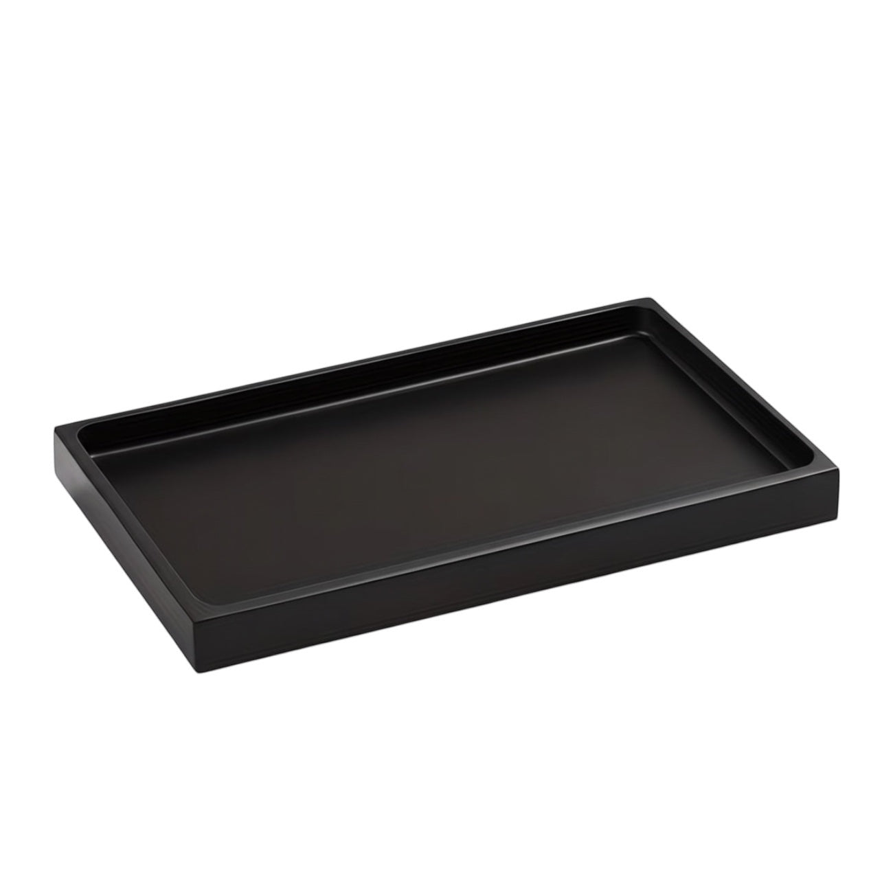 Eclectic minimalist black rectangular vanity tray with a smooth matte silicone finish for bathroom organization.