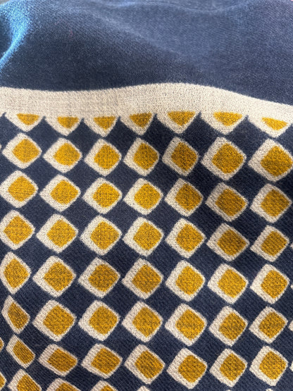 Eclectic navy and gold cashmere wool blend scarf featuring a geometric diamond pattern in a soft lightweight weave.