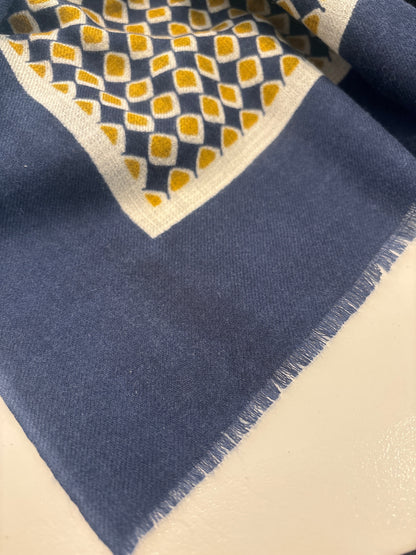 Eclectic navy and gold cashmere blend scarf with a geometric diamond pattern and delicate frayed edge detail.