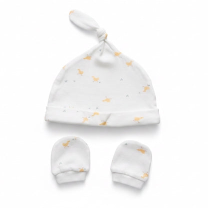 Eclectic newborn knotted hat and matching mittens set in white cotton with a soft yellow duck print.