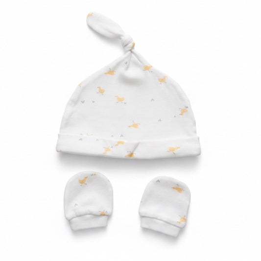 Eclectic newborn knotted hat and matching mittens set in white cotton with a soft yellow duck print.