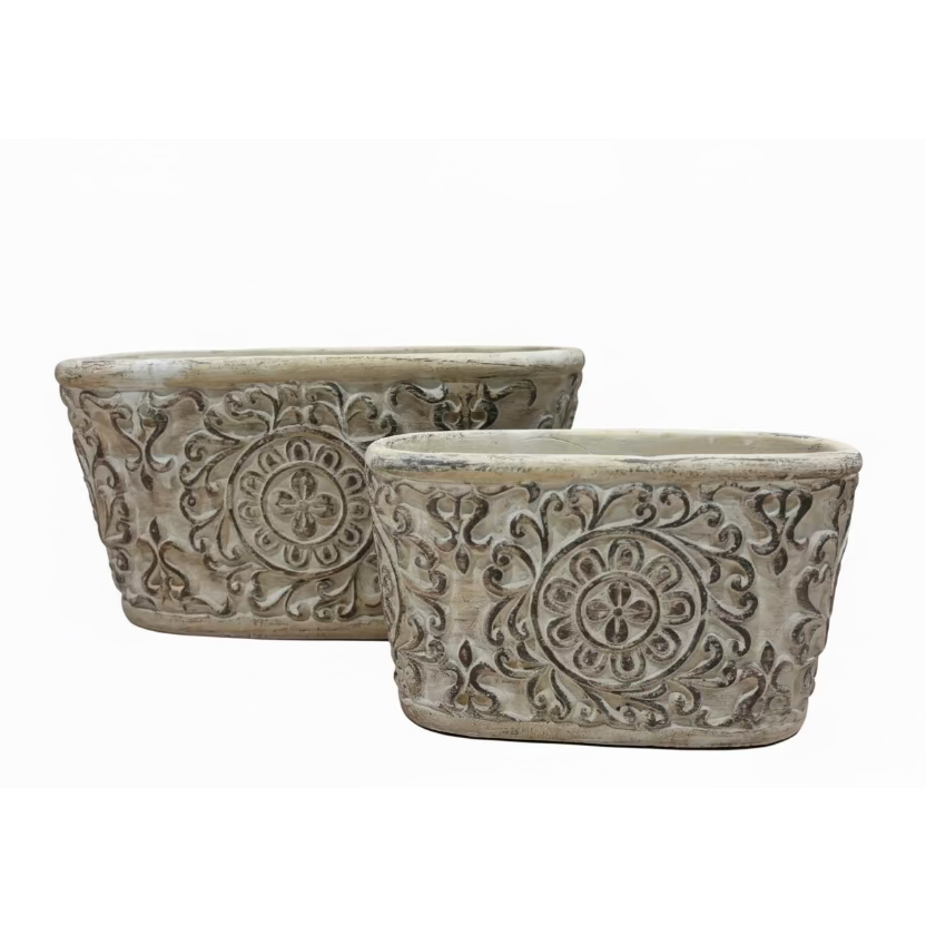 Two Eclectic oval cement herb planters with distressed antique patina and intricate European scrollwork detailing.