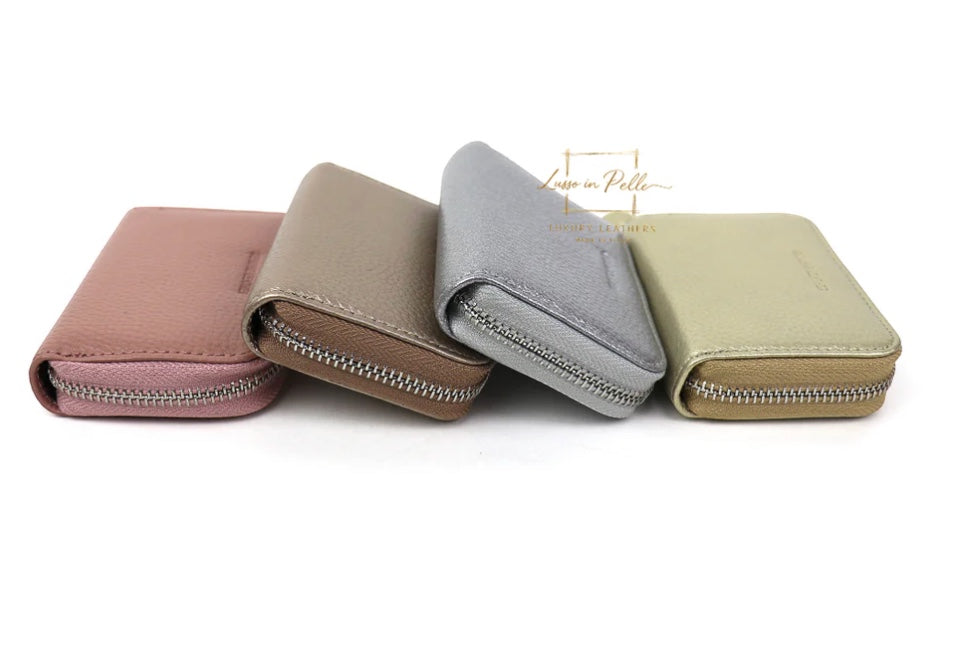 Eclectic zip-around card holders in pink, taupe, silver, and gold pebbled Italian leather with silver hardware