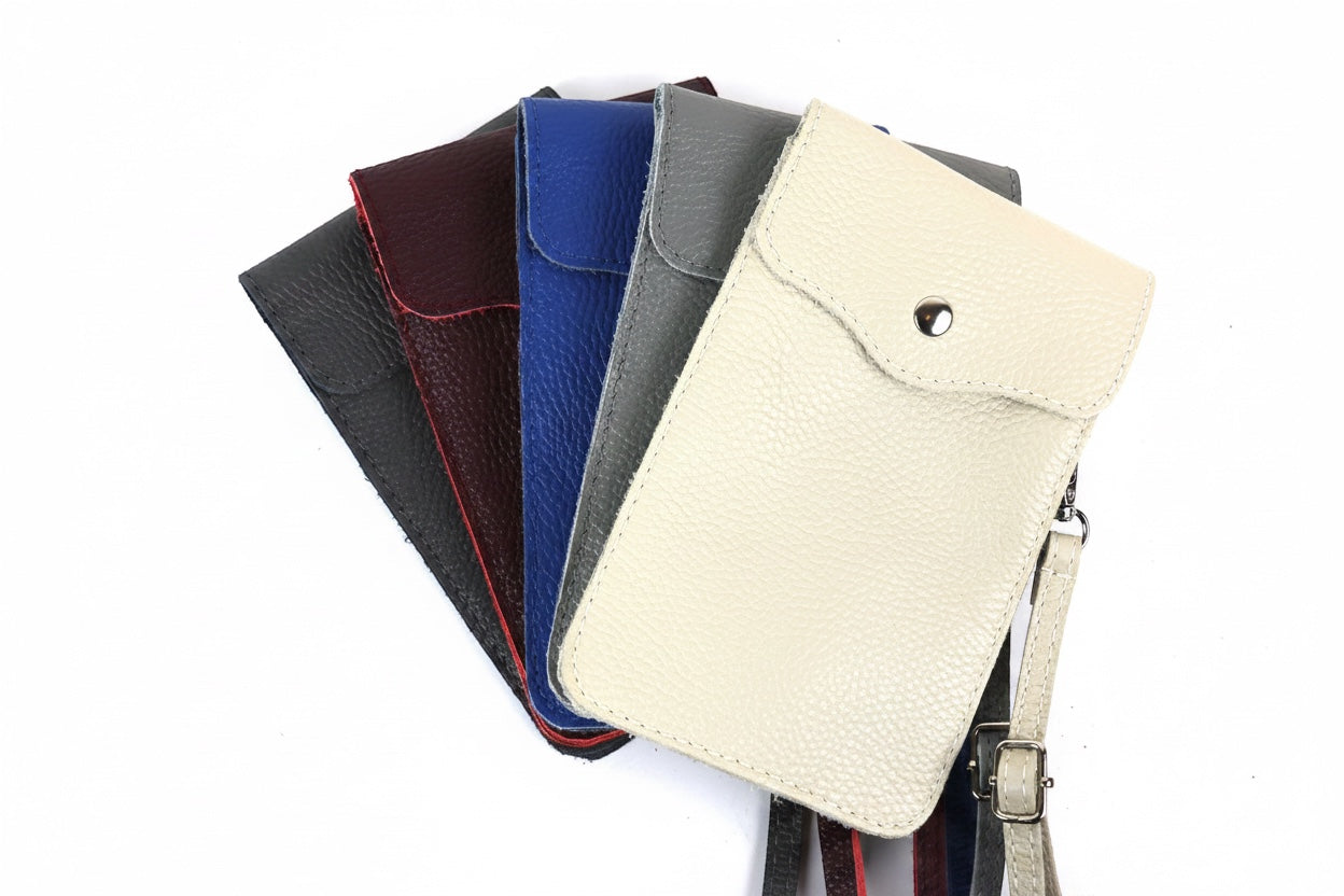 Eclectic genuine pebbled leather phone crossbody bags in cream, grey, blue, burgundy, and black with silver hardware.