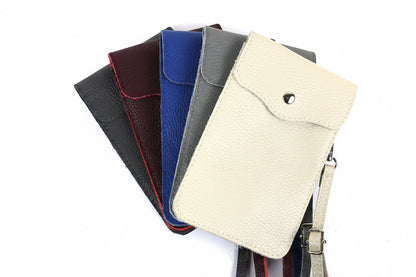 Eclectic genuine pebbled leather phone crossbody bags in cream, grey, blue, burgundy, and black with silver hardware.